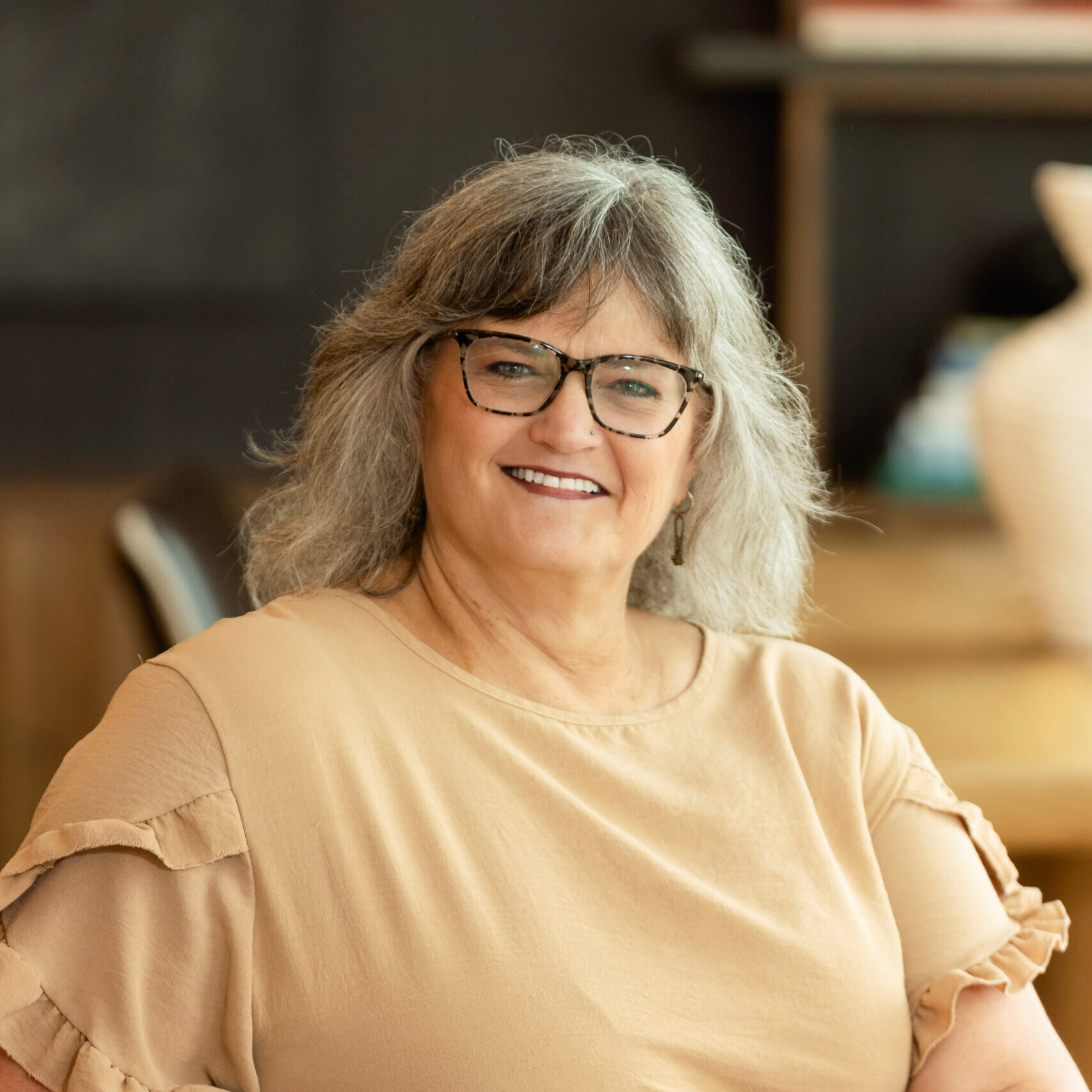 Portrait of Jodi, front desk administrator